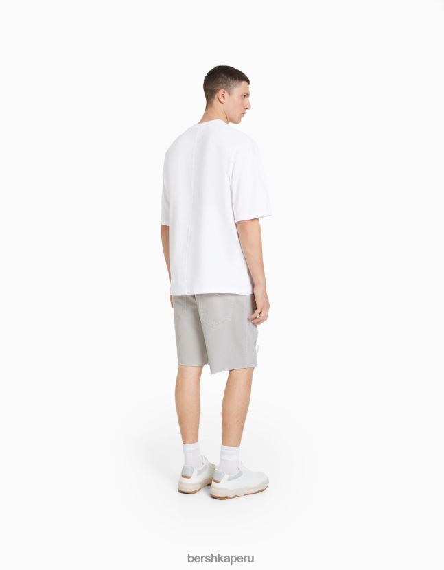 gris Bershka hombres bermudas de mezclilla con rotos de colores 806J6B3309