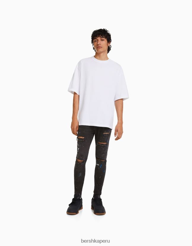 negro Bershka hombres skinny jeans rotos con salpicaduras de pintura 806J6B3171