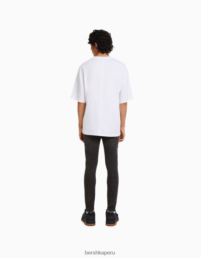 negro Bershka hombres skinny jeans rotos con salpicaduras de pintura 806J6B3171